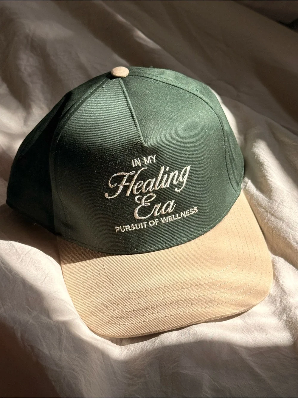 BLOOM’s MARI LUELLEN PERSUIT OF WELLNESS Healing Era TRUCKER HAT